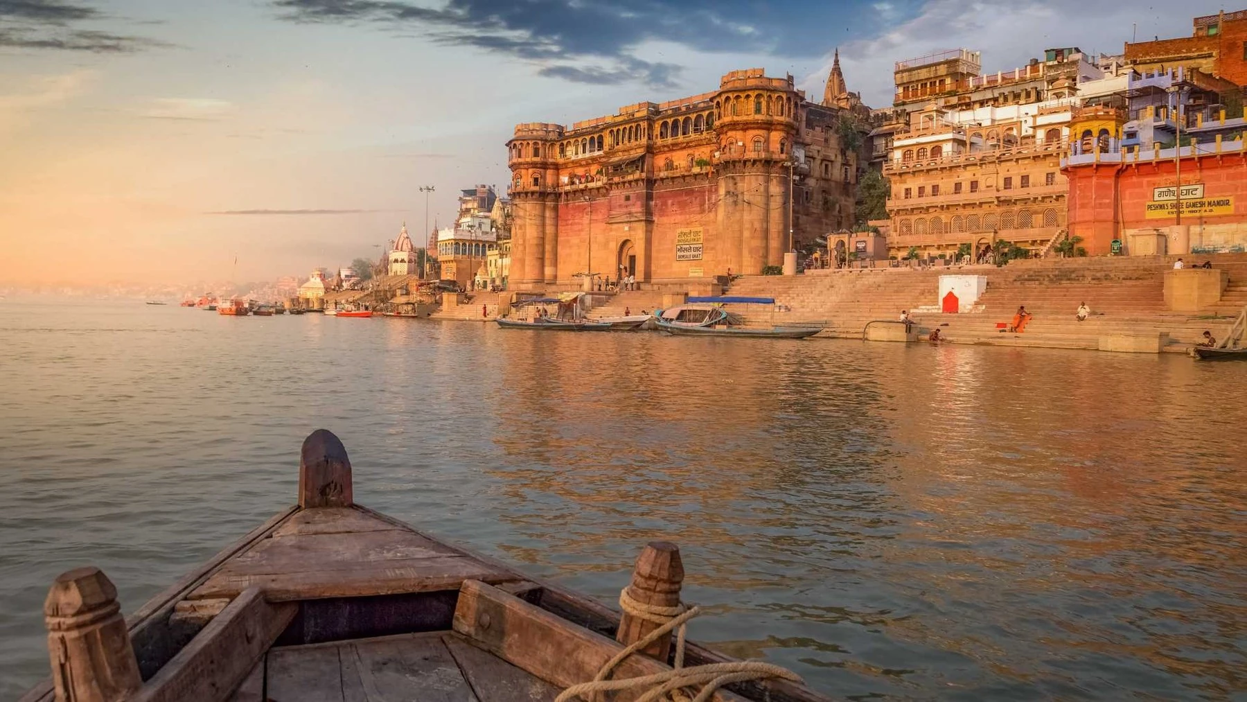 Varanasi ghats seen from a wooden boat on the Ganges